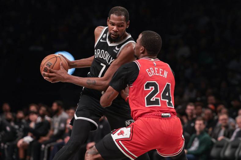 Nov 1, 2022; Brooklyn, New York, USA; Brooklyn Nets forward Kevin Durant (7) shields the ball from Chicago Bulls forward Javonte Green (24) during the first half at Barclays Center. Mandatory Credit: Vincent Carchietta-USA TODAY Sports