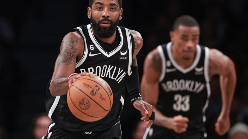 Nov 1, 2022; Brooklyn, New York, USA; Brooklyn Nets guard Kyrie Irving (11) dribbles up court against the Chicago Bulls during the first half at Barclays Center. Mandatory Credit: Vincent Carchietta-USA TODAY Sports