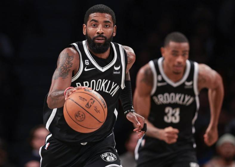 Nov 1, 2022; Brooklyn, New York, USA; Brooklyn Nets guard Kyrie Irving (11) dribbles up court against the Chicago Bulls during the first half at Barclays Center. Mandatory Credit: Vincent Carchietta-USA TODAY Sports