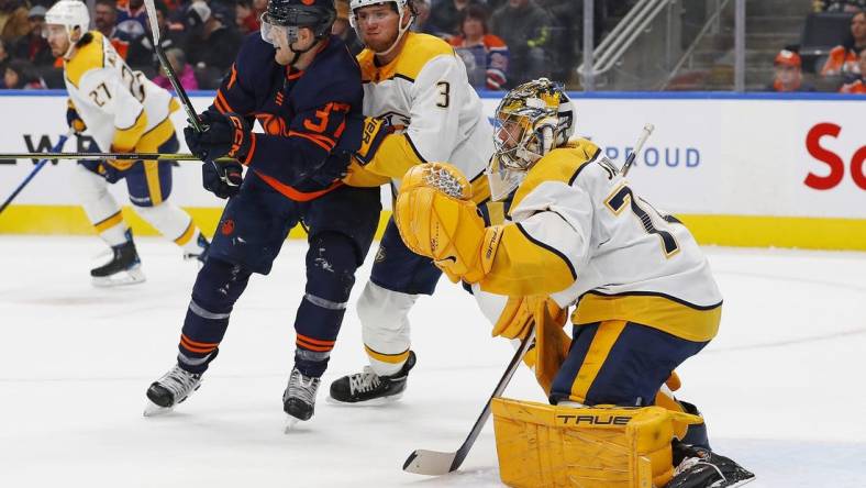 Nov 1, 2022; Edmonton, Alberta, CAN; Edmonton Oilers forward Warren Foegele (37) battles for position with Nashville Predators defensemen Jeremy Lauzon (3) in front of goaltender Juuse Saros (74) during the first period at Rogers Place. Mandatory Credit: Perry Nelson-USA TODAY Sports