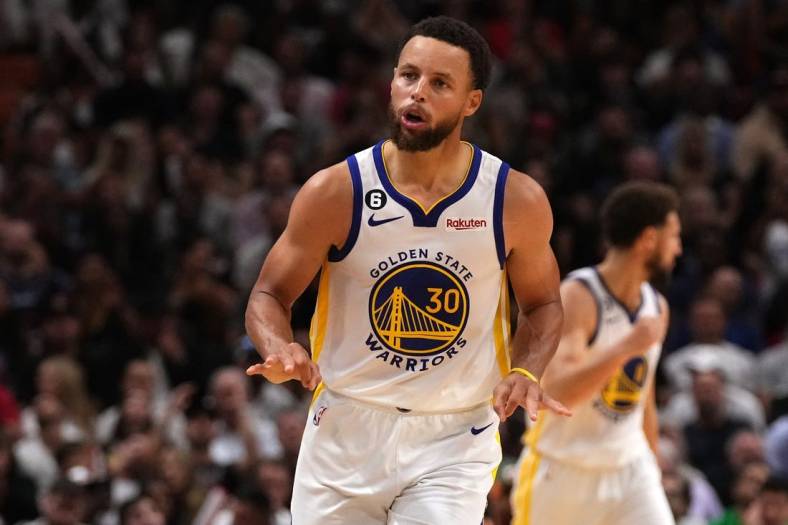 Nov 1, 2022; Miami, Florida, USA; Golden State Warriors guard Stephen Curry (30) gestures after making a three point basket against the Miami Heat during the second half at FTX Arena. Mandatory Credit: Jasen Vinlove-USA TODAY Sports