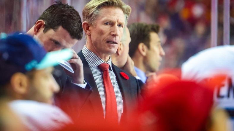 Nov 1, 2022; Calgary, Alberta, CAN; Seattle Kraken head coach Dave Hakstol on his bench against the Calgary Flames during the second period at Scotiabank Saddledome. Mandatory Credit: Sergei Belski-USA TODAY Sports