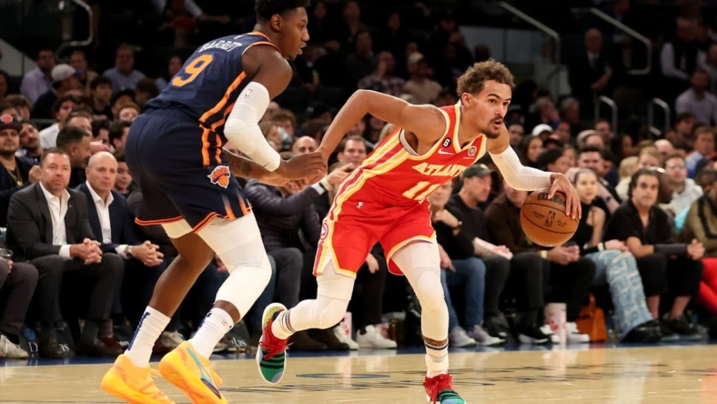 Nov 2, 2022; New York, New York, USA; Atlanta Hawks guard Trae Young (11) controls the ball against New York Knicks guard RJ Barrett (9) during the first quarter at Madison Square Garden. Mandatory Credit: Brad Penner-USA TODAY Sports