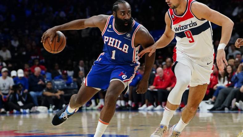 Nov 2, 2022; Philadelphia, Pennsylvania, USA; Philadelphia 76ers guard James Harden (1) dribbles against Washington Wizards forward Deni Avdija (9) during the second half at Wells Fargo Center. Mandatory Credit: Gregory Fisher-USA TODAY Sports