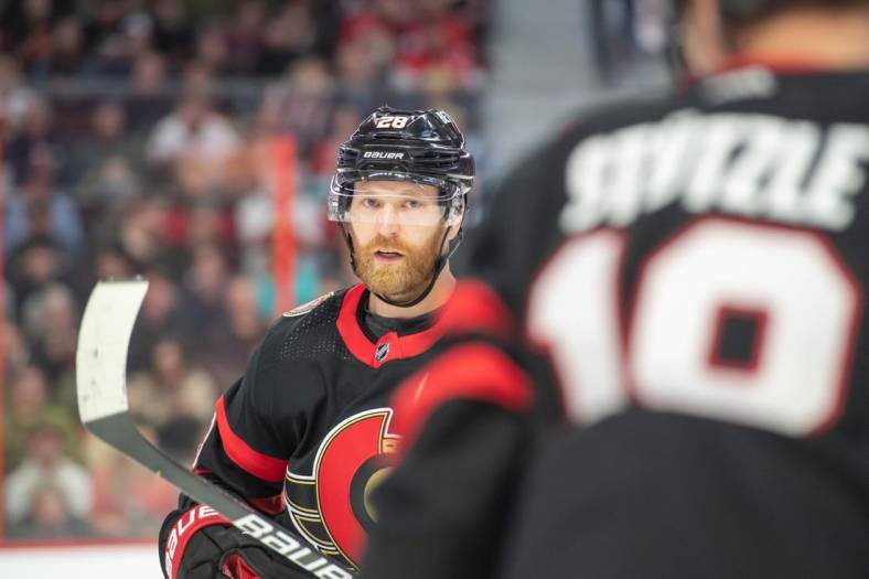 Nov 3, 2022; Ottawa, Ontario, CAN; Ottawa Senators right wing Claude Giroux (28) looks over to left wing Tim Stutzle (18) in the first period against Vegas Golden Knights at the Canadian Tire Centre. Mandatory Credit: Marc DesRosiers-USA TODAY Sports