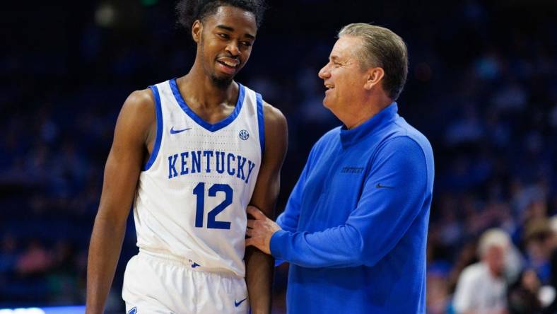 Nov 3, 2022; Lexington, Kentucky, USA; Kentucky Wildcats guard Antonio Reeves (12) talks with head coach John Calipari during the second half against the Kentucky State Thoroughbreds at Rupp Arena at Central Bank Center. Mandatory Credit: Jordan Prather-USA TODAY Sports