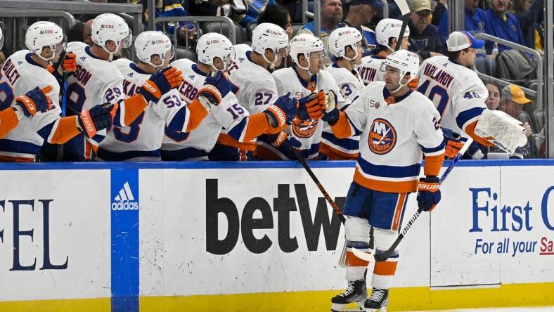 Nov 3, 2022; St. Louis, Missouri, USA;  New York Islanders center Kyle Palmieri (21) is congratulated by teammates after scoring against the St. Louis Blues during the second period at Enterprise Center. Mandatory Credit: Jeff Curry-USA TODAY Sports