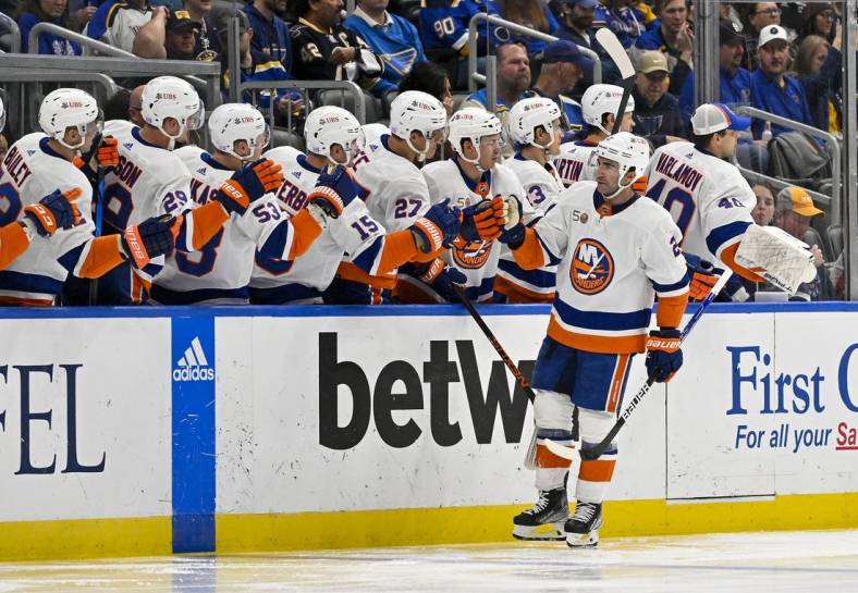 Nov 3, 2022; St. Louis, Missouri, USA;  New York Islanders center Kyle Palmieri (21) is congratulated by teammates after scoring against the St. Louis Blues during the second period at Enterprise Center. Mandatory Credit: Jeff Curry-USA TODAY Sports