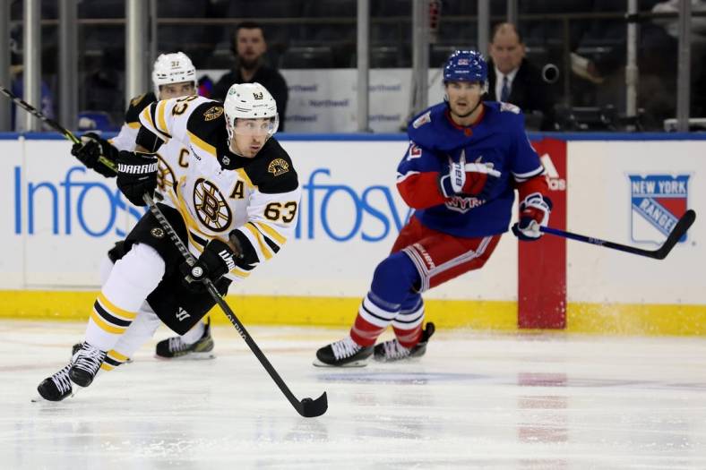 Nov 3, 2022; New York, New York, USA; Boston Bruins left wing Brad Marchand (63) controls the puck against the New York Rangers during the second period at Madison Square Garden. Mandatory Credit: Brad Penner-USA TODAY Sports