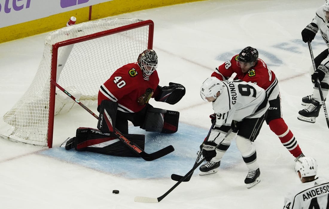 Nov 3, 2022; Chicago, Illinois, USA; Los Angeles Kings right wing Carl Grundstrom (91) skates in on Chicago Blackhawks goaltender Arvid Soderblom (40) during the second period at United Center. Mandatory Credit: David Banks-USA TODAY Sports