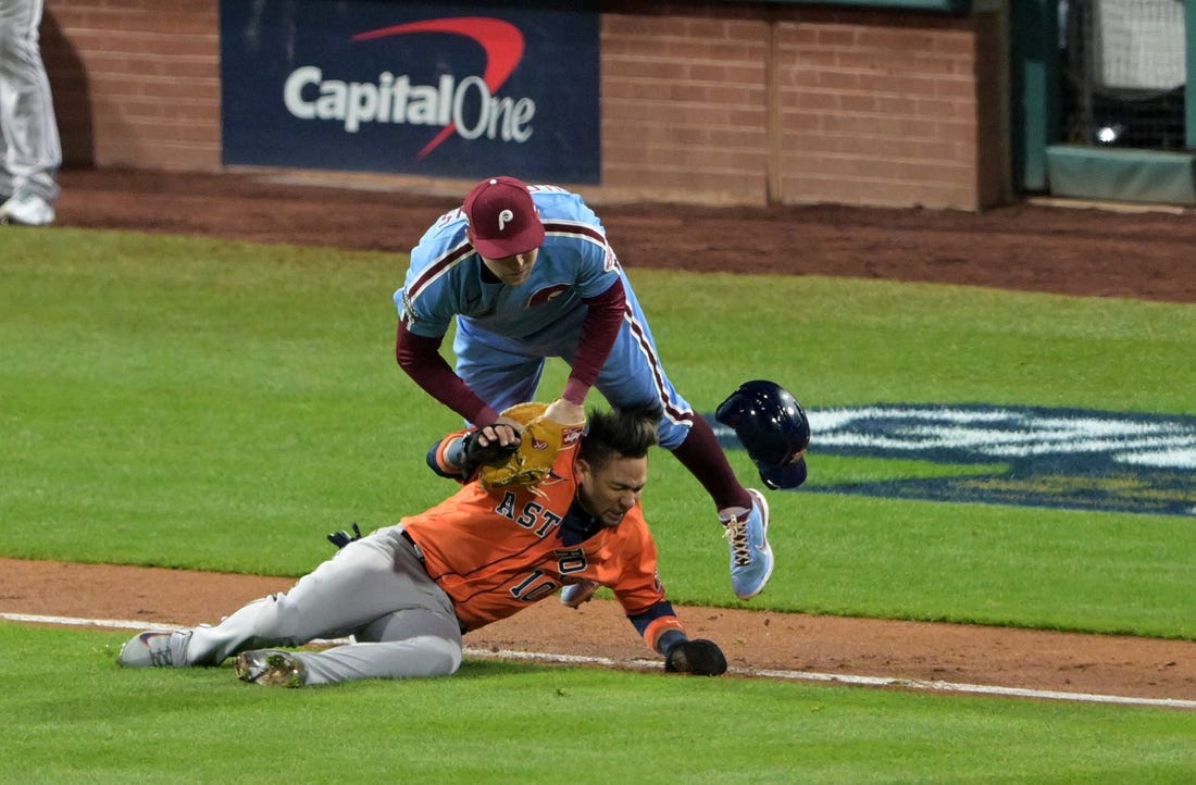 Nov 3, 2022; Philadelphia, Pennsylvania, USA;  Philadelphia Phillies first baseman Rhys Hoskins (17) makes the tag on Houston Astros first baseman Yuli Gurriel (10) in a run down during the seventh inning in game five of the 2022 World Series at Citizens Bank Park. Mandatory Credit: John Geliebter-USA TODAY Sports