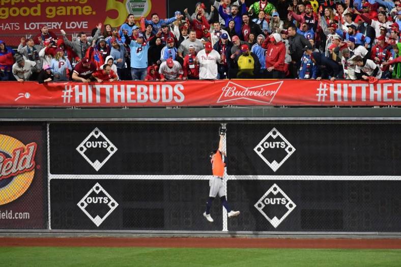Nov 3, 2022; Philadelphia, Pennsylvania, USA; Houston Astros left fielder Chas McCormick (20) makes a catch on the fly ball hit by Philadelphia Phillies catcher J.T. Realmuto (not pictured) for the second out during the eighth inning in game five of the 2022 World Series at Citizens Bank Park. Mandatory Credit: Eric Hartline-USA TODAY Sports