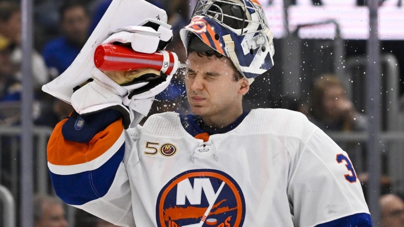Nov 3, 2022; St. Louis, Missouri, USA;  New York Islanders goaltender Ilya Sorokin (30) sprays water on his face during the second period against the St. Louis Blues at Enterprise Center. Mandatory Credit: Jeff Curry-USA TODAY Sports