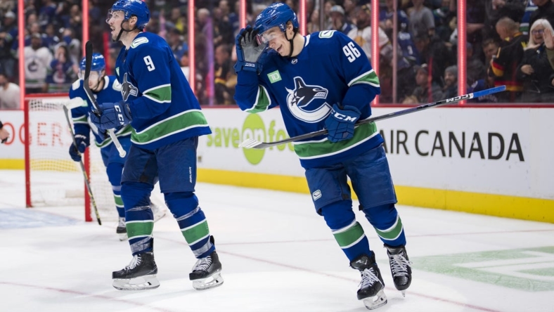 Nov 3, 2022; Vancouver, British Columbia, CAN; Vancouver Canucks forward forward J.T. Miller (9) and forward Andrei Kuzmenko (96) celebrate Kuzemko   s first goal of the game against the Anaheim Ducks in the third period at Rogers Arena. Canucks won 8-5. Mandatory Credit: Bob Frid-USA TODAY Sports