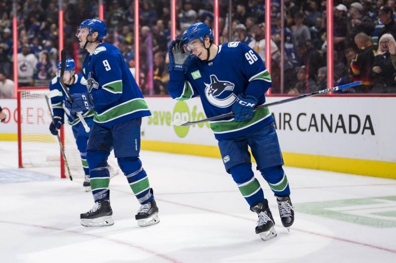 Nov 3, 2022; Vancouver, British Columbia, CAN; Vancouver Canucks forward forward J.T. Miller (9) and forward Andrei Kuzmenko (96) celebrate Kuzemko   s first goal of the game against the Anaheim Ducks in the third period at Rogers Arena. Canucks won 8-5. Mandatory Credit: Bob Frid-USA TODAY Sports