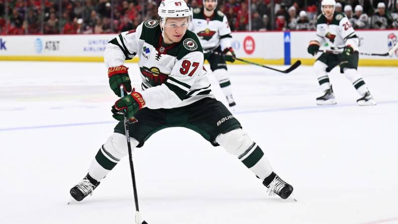 Oct 30, 2022; Chicago, Illinois, USA;  Minnesota Wild forward Kirill Kaprizov (97) skates against the Chicago Blackhawks at the United Center. Mandatory Credit: Jamie Sabau-USA TODAY Sports