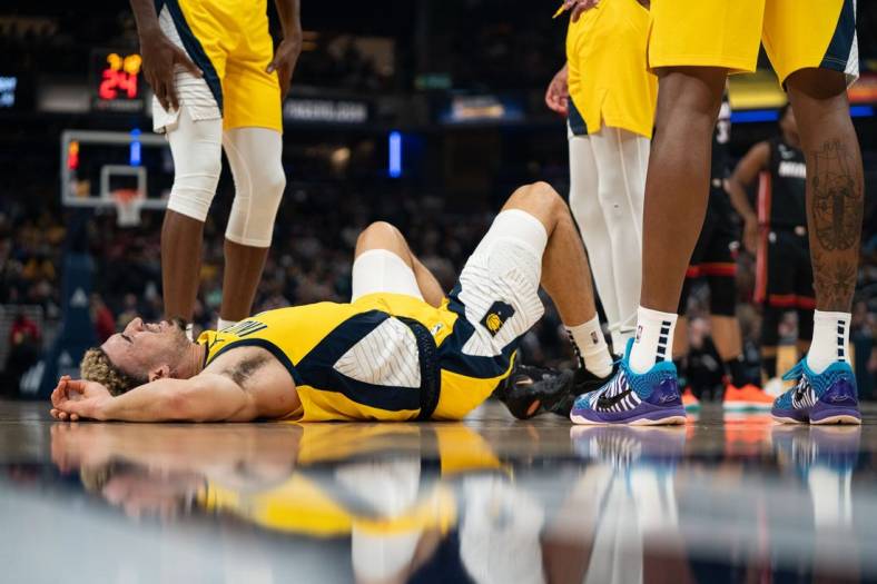 Nov 4, 2022; Indianapolis, Indiana, USA; Indiana Pacers guard Chris Duarte (3) lays on the ground after falling during a game against the Miami Heat at Gainbridge Fieldhouse. Mandatory Credit: Jacob Musselman-USA TODAY Sports