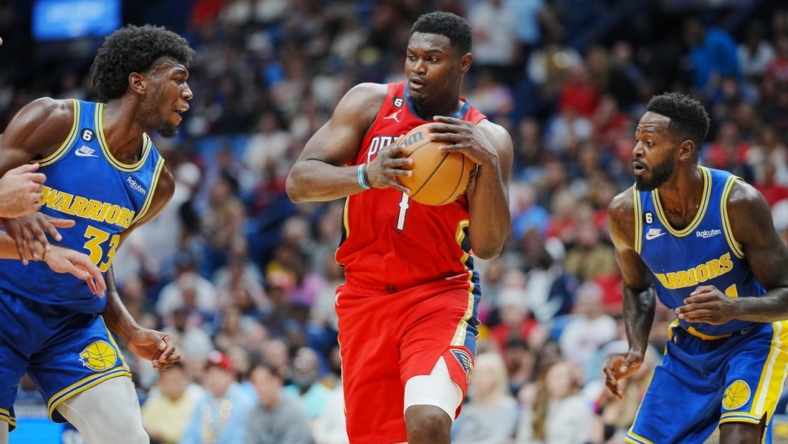 Nov 4, 2022; New Orleans, Louisiana, USA; New Orleans Pelicans forward Zion Williamson (1) recovers the ball against Golden State Warriors center James Wiseman (33) during the first quarter at Smoothie King Center. Mandatory Credit: Andrew Wevers-USA TODAY Sports