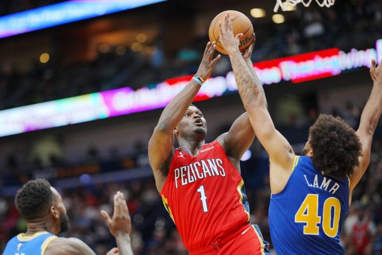 Nov 4, 2022; New Orleans, Louisiana, USA; New Orleans Pelicans forward Zion Williamson (1) shoots the ball against Golden State Warriors forward Anthony Lamb (40) during the fourth quarter at Smoothie King Center. Mandatory Credit: Andrew Wevers-USA TODAY Sports