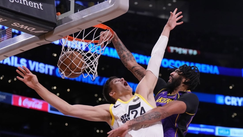 Nov 4, 2022; Los Angeles, California, USA; Los Angeles Lakers forward Anthony Davis (3) dunks the ball against Utah Jazz center Walker Kessler (24) in the first half at Crypto.com Arena. Mandatory Credit: Kirby Lee-USA TODAY Sports