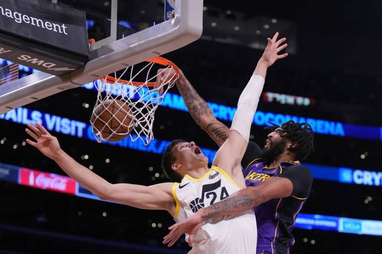 Nov 4, 2022; Los Angeles, California, USA; Los Angeles Lakers forward Anthony Davis (3) dunks the ball against Utah Jazz center Walker Kessler (24) in the first half at Crypto.com Arena. Mandatory Credit: Kirby Lee-USA TODAY Sports