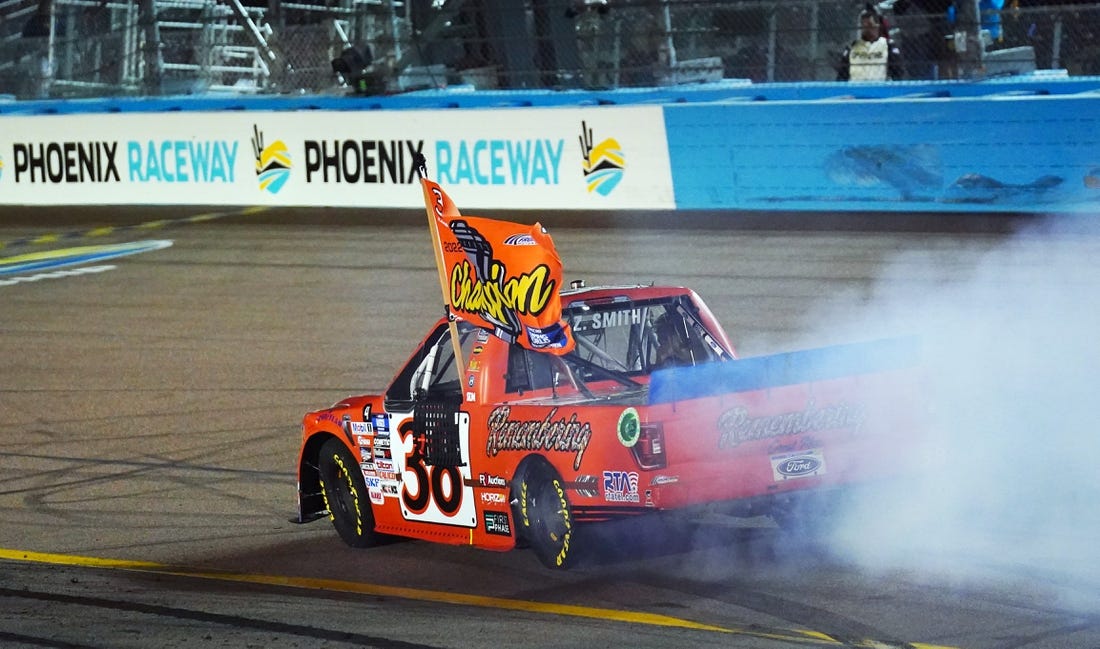 Nov 4, 2022; Avondale, Arizona, USA; Camping World Truck Series driver Zane Smith (38) celebrates winning the Truck Series Championship at Phoenix Raceway. Mandatory Credit: John David Mercer-USA TODAY Sports