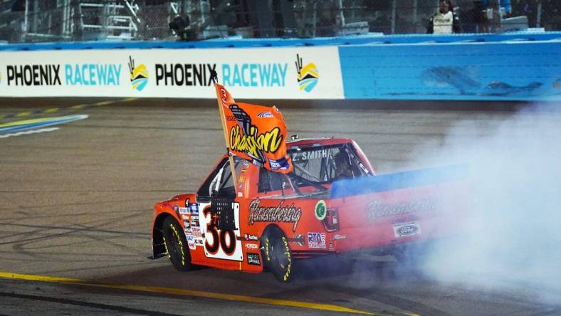 Nov 4, 2022; Avondale, Arizona, USA; Camping World Truck Series driver Zane Smith (38) celebrates winning the Truck Series Championship at Phoenix Raceway. Mandatory Credit: John David Mercer-USA TODAY Sports