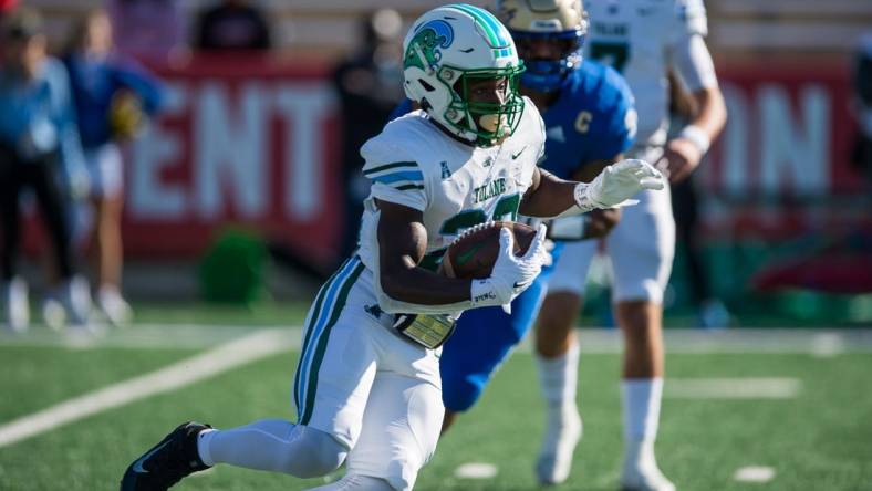 Nov 5, 2022; Tulsa, Oklahoma, USA;  Tulane Green Wave running back Tyjae Spears (22) runs the ball during the first quarter against the Tulsa Golden Hurricane at Skelly Field at H.A. Chapman Stadium. Mandatory Credit: Brett Rojo-USA TODAY Sports