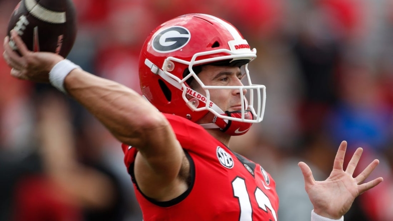 Georgia quarterback Stetson Bennett (13) warms up before the start of a NCAA college football game between Tennessee and Georgia in Athens, Ga., on Saturday, Nov. 5, 2022.

News Joshua L Jones