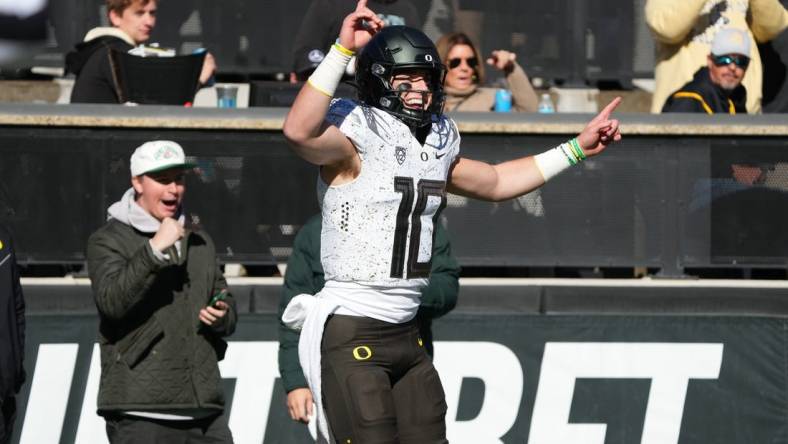 Nov 5, 2022; Boulder, Colorado, USA; Oregon Ducks quarterback Bo Nix (10) celebrates his touchdown reception in in the first quarter against the Colorado Buffaloes at Folsom Field. Mandatory Credit: Ron Chenoy-USA TODAY Sports