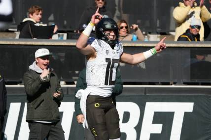 Nov 5, 2022; Boulder, Colorado, USA; Oregon Ducks quarterback Bo Nix (10) celebrates his touchdown reception in in the first quarter against the Colorado Buffaloes at Folsom Field. Mandatory Credit: Ron Chenoy-USA TODAY Sports