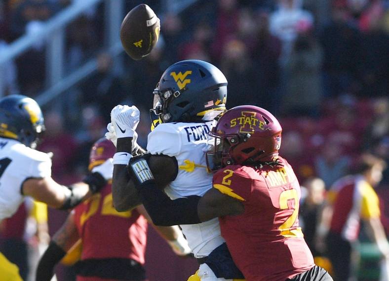 Iowa State Cyclones defensive back T.J. Tampa (2) knocks the ball out from West Virginia Mountaineers wide receiver Bryce Ford-Wheaton (0) during the first half in the Big-12 showdown at Jack Trice Stadium Saturday, Nov. 5. 2022, in Ames, Iowa.

Ncaa Football Baylor At Iowa State