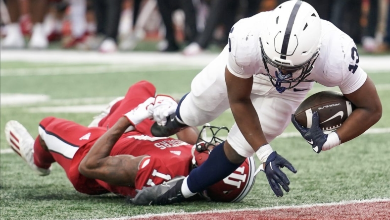 Nov 5, 2022; Bloomington, Indiana, USA; Penn State Nittany Lions running back Kaytron Allen (13) runs for a touchdown past Indiana Hoosiers defensive back Jonathan Haynes (17) during the first half at Memorial Stadium. Mandatory Credit: Robert Goddin-USA TODAY Sports