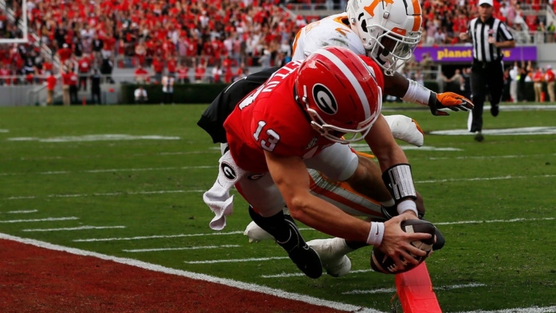 Georgia quarterback Stetson Bennett (13) scores a touchdown during the first half of a NCAA college football game between Tennessee and Georgia in Athens, Ga., on Saturday, Nov. 5, 2022.

News Joshua L Jones