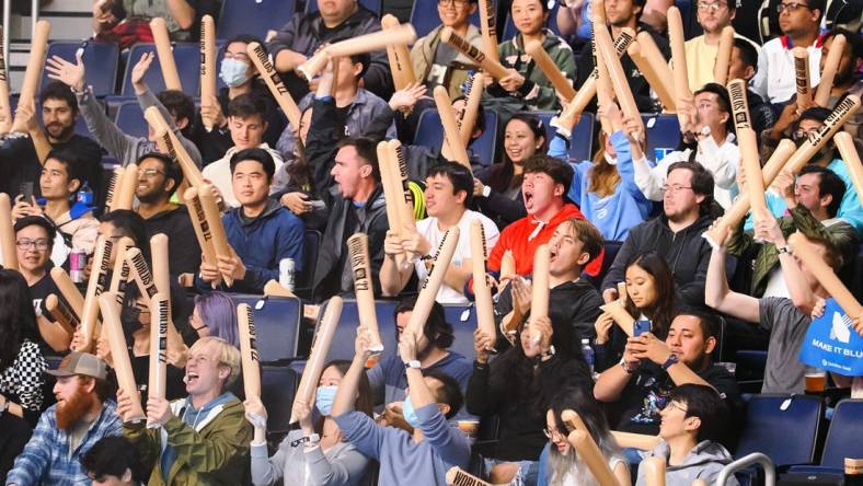 Nov 5, 2022; San Francisco, California, USA; Fans wave thunder sticks before the League of Legends World Championship at Chase Center. Mandatory Credit: Kelley L Cox-USA TODAY Sports