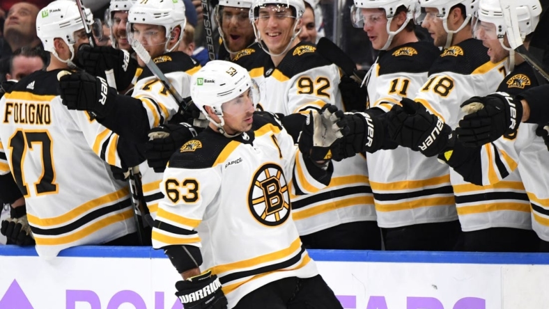 Nov 5, 2022; Toronto, Ontario, CAN; Boston Bruins forward Brad Marchand (63) celebrates with teammates after scoring on a penalty shot against the Toronto Maple Leafs in the second period at Scotiabank Arena. Mandatory Credit: Dan Hamilton-USA TODAY Sports