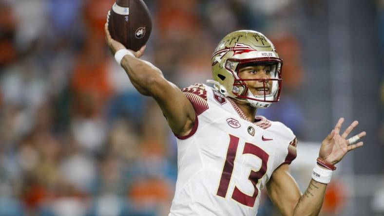 Nov 5, 2022; Miami Gardens, Florida, USA; Florida State Seminoles quarterback Jordan Travis (13) throws the football during the second quarter against the Miami Hurricanes at Hard Rock Stadium. Mandatory Credit: Sam Navarro-USA TODAY Sports