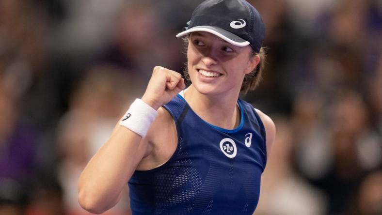 Nov 5, 2022; Forth Worth, TX, USA; Iga Swiatek (POL) celebrates after defeating Coco Gauff (USA) on day six of the WTA Finals at Dickies Arena. Mandatory Credit: Susan Mullane-USA TODAY Sports