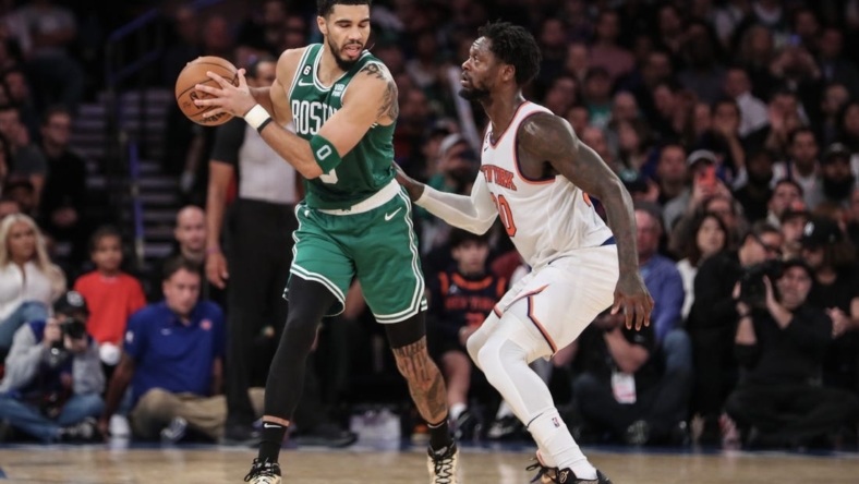 Nov 5, 2022; New York, New York, USA;  Boston Celtics forward Jayson Tatum (0) is guarded by New York Knicks forward Julius Randle (30) in the fourth quarter at Madison Square Garden. Mandatory Credit: Wendell Cruz-USA TODAY Sports