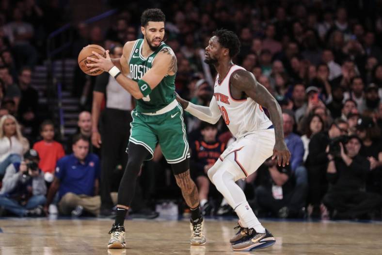 Nov 5, 2022; New York, New York, USA;  Boston Celtics forward Jayson Tatum (0) is guarded by New York Knicks forward Julius Randle (30) in the fourth quarter at Madison Square Garden. Mandatory Credit: Wendell Cruz-USA TODAY Sports