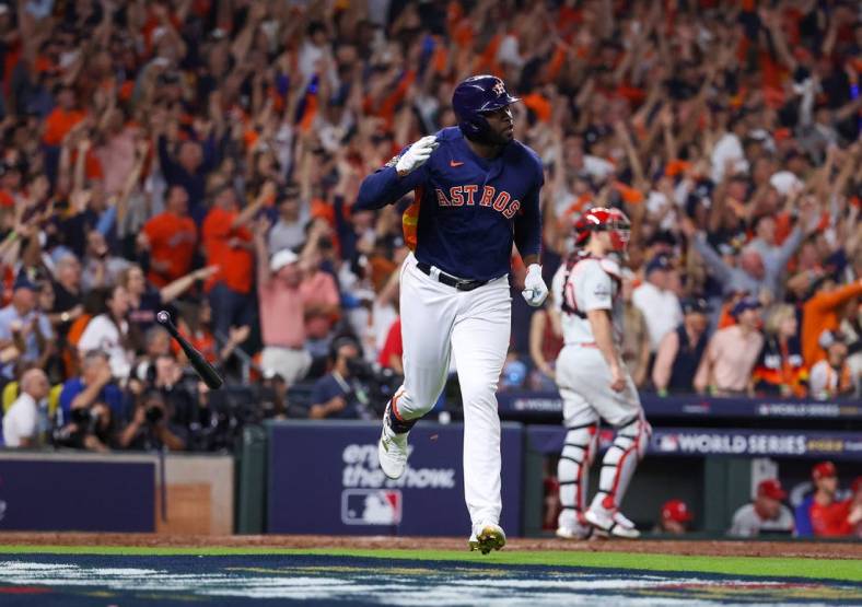 Nov 5, 2022; Houston, Texas, USA; Houston Astros left fielder Yordan Alvarez (44) flips his bat after hitting a three run against the Philadelphia Phillies during the sixth inning  in game six of the 2022 World Series at Minute Maid Park. Mandatory Credit: Troy Taormina-USA TODAY Sports