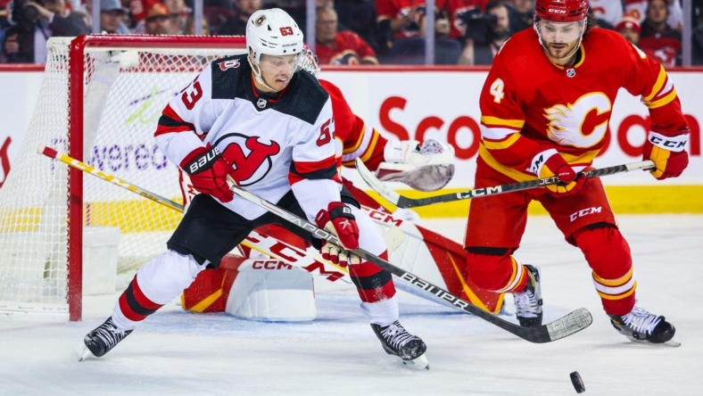 Nov 5, 2022; Calgary, Alberta, CAN; New Jersey Devils left wing Jesper Bratt (63) controls the puck against the Calgary Flames during the first period at Scotiabank Saddledome. Mandatory Credit: Sergei Belski-USA TODAY Sports