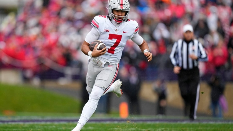 Nov 5, 2022; Evanston, Illinois, USA; Ohio State Buckeyes quarterback C.J. Stroud (7) rushes upfield during the second half of the NCAA football game against the Northwestern Wildcats at Ryan Field. Mandatory Credit: Adam Cairns-The Columbus Dispatch

Ncaa Football Ohio State Buckeyes At Northwestern Wildcats