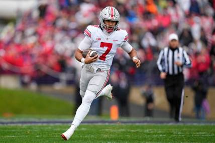 Nov 5, 2022; Evanston, Illinois, USA; Ohio State Buckeyes quarterback C.J. Stroud (7) rushes upfield during the second half of the NCAA football game against the Northwestern Wildcats at Ryan Field. Mandatory Credit: Adam Cairns-The Columbus Dispatch

Ncaa Football Ohio State Buckeyes At Northwestern Wildcats