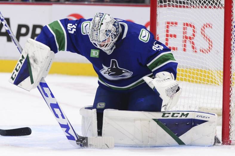 Nov 5, 2022; Vancouver, British Columbia, CAN;  -Vancouver Canucks goaltender Thatcher Demko (35) blocks a shot on net by the Nashville Predators during overtime at Rogers Arena. Mandatory Credit: Anne-Marie Sorvin-USA TODAY Sports
