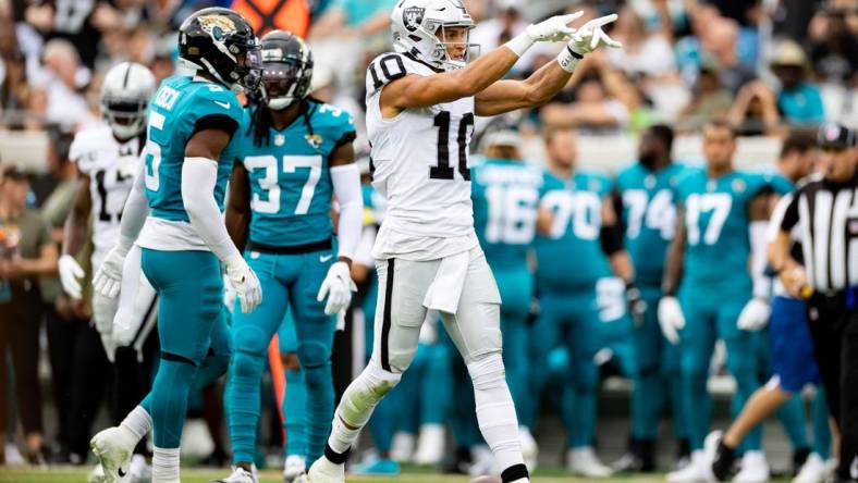 Nov 6, 2022; Jacksonville, Florida, USA; Las Vegas Raiders wide receiver Mack Hollins (10) gestures after a first down during the first half against the Jacksonville Jaguars at TIAA Bank Field. Mandatory Credit: Matt Pendleton-USA TODAY Sports