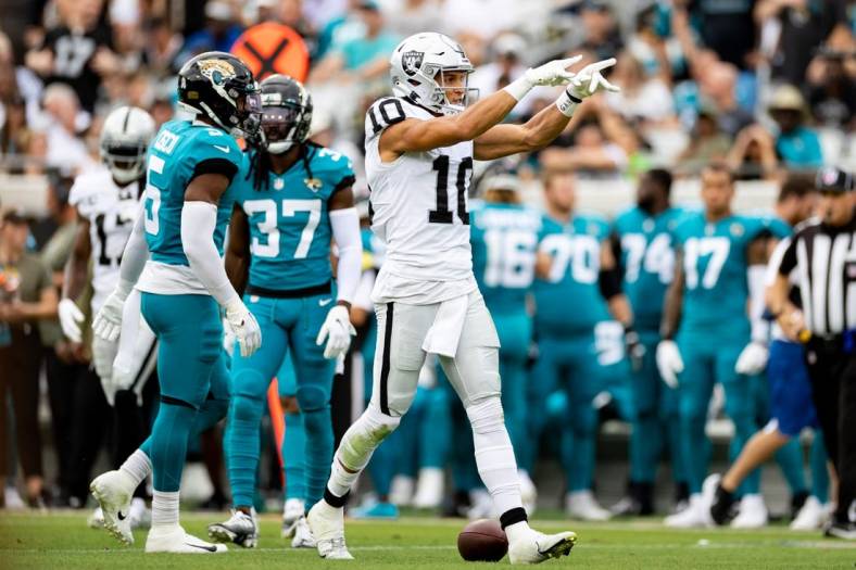 Nov 6, 2022; Jacksonville, Florida, USA; Las Vegas Raiders wide receiver Mack Hollins (10) gestures after a first down during the first half against the Jacksonville Jaguars at TIAA Bank Field. Mandatory Credit: Matt Pendleton-USA TODAY Sports