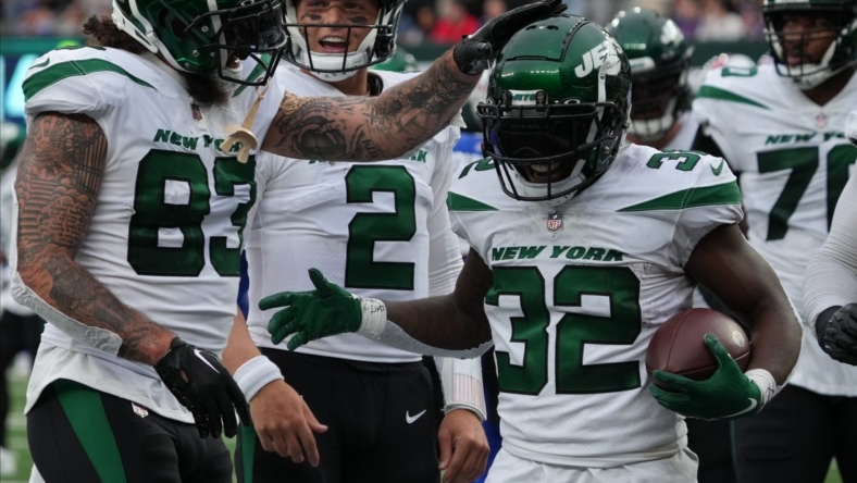 Tyler Conklin and Zach Wilson of the Jets celebrate with Michael Carter of the Jets after he scored a TD in the first half as the New York Jets host the Buffalo Bills in an AFC East game played at MetLife Stadium in East Rutherford, NJ on November 6 2022.

As The New York Jets Host The Buffalo Bills In An Afc East Game Played At Metlife Stadium In East Rutherford Nj On November 6 2022