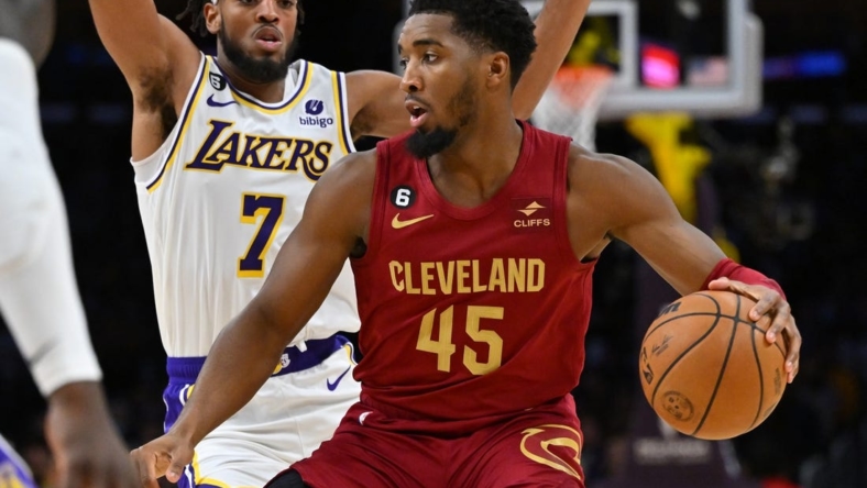 Nov 6, 2022; Los Angeles, California, USA;  Los Angeles Lakers forward Troy Brown Jr. (7) guards Cleveland Cavaliers guard Donovan Mitchell (45) as he drives to the basket in the first half at Crypto.com Arena. Mandatory Credit: Jayne Kamin-Oncea-USA TODAY Sports