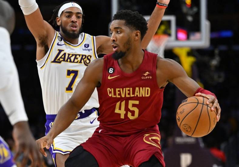 Nov 6, 2022; Los Angeles, California, USA;  Los Angeles Lakers forward Troy Brown Jr. (7) guards Cleveland Cavaliers guard Donovan Mitchell (45) as he drives to the basket in the first half at Crypto.com Arena. Mandatory Credit: Jayne Kamin-Oncea-USA TODAY Sports